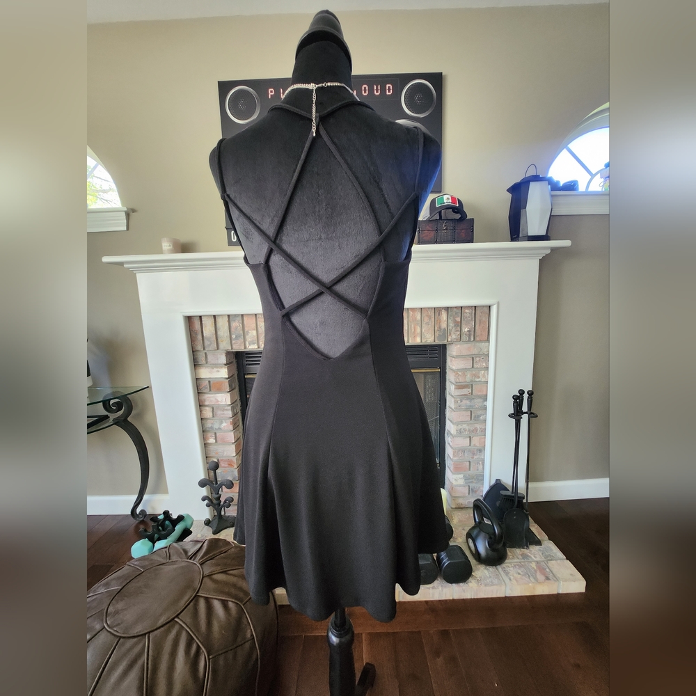 Beatiful black dress, neckline on the back.  Size: Medium